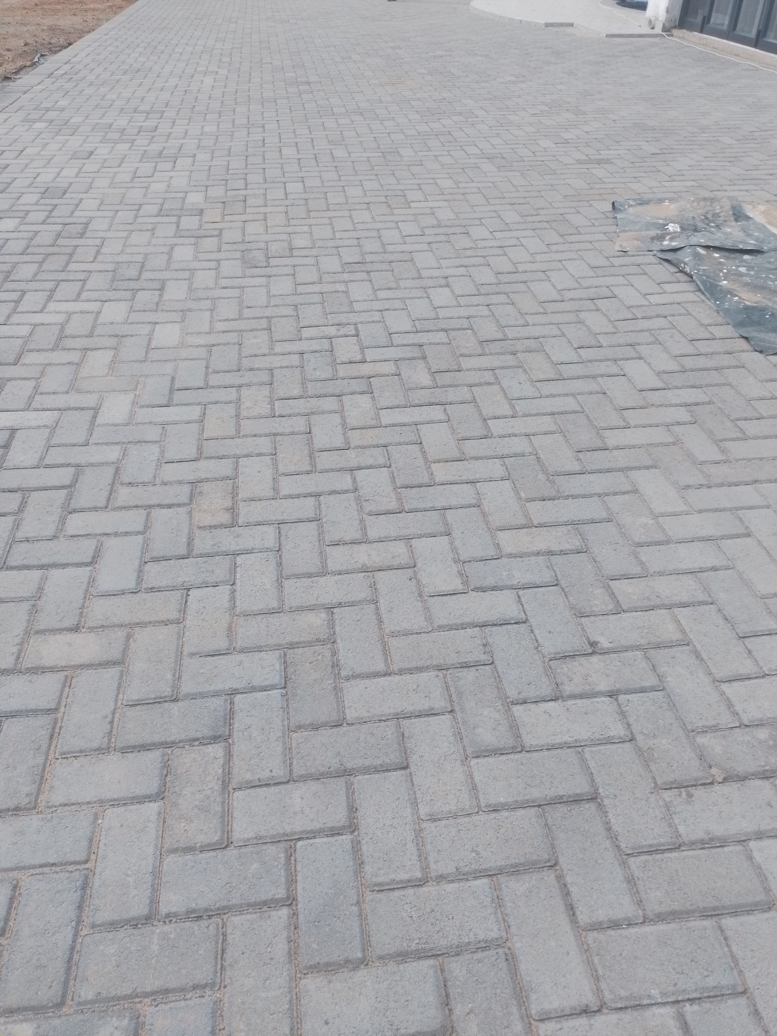 Completed grey interlocking paving surface