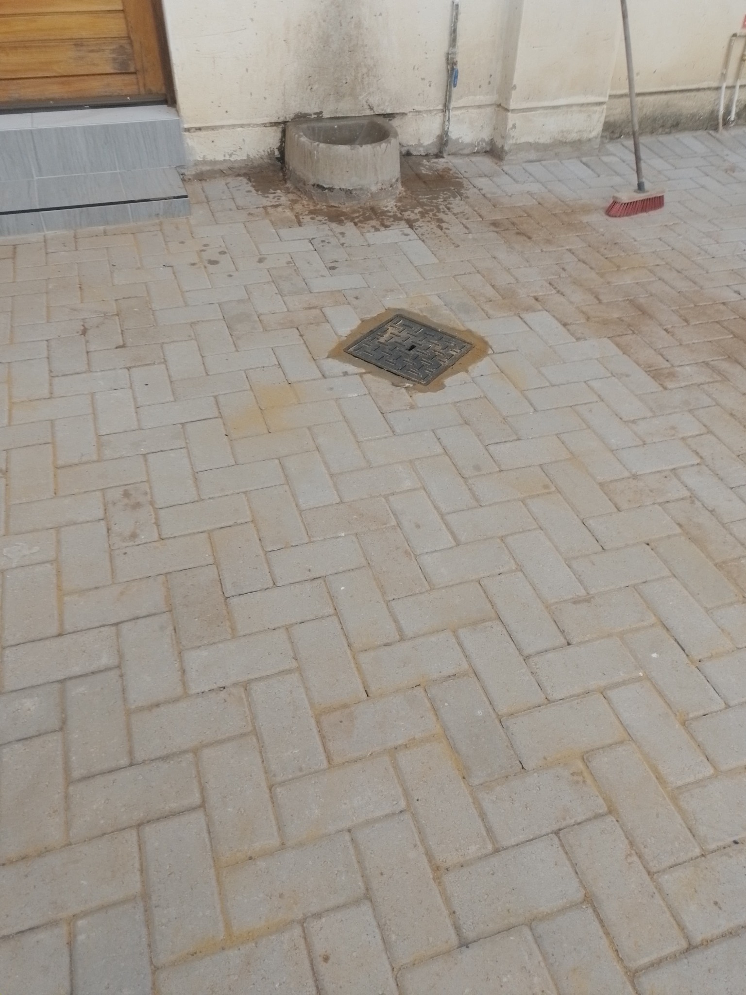 Completed paving installed around a drainage point
